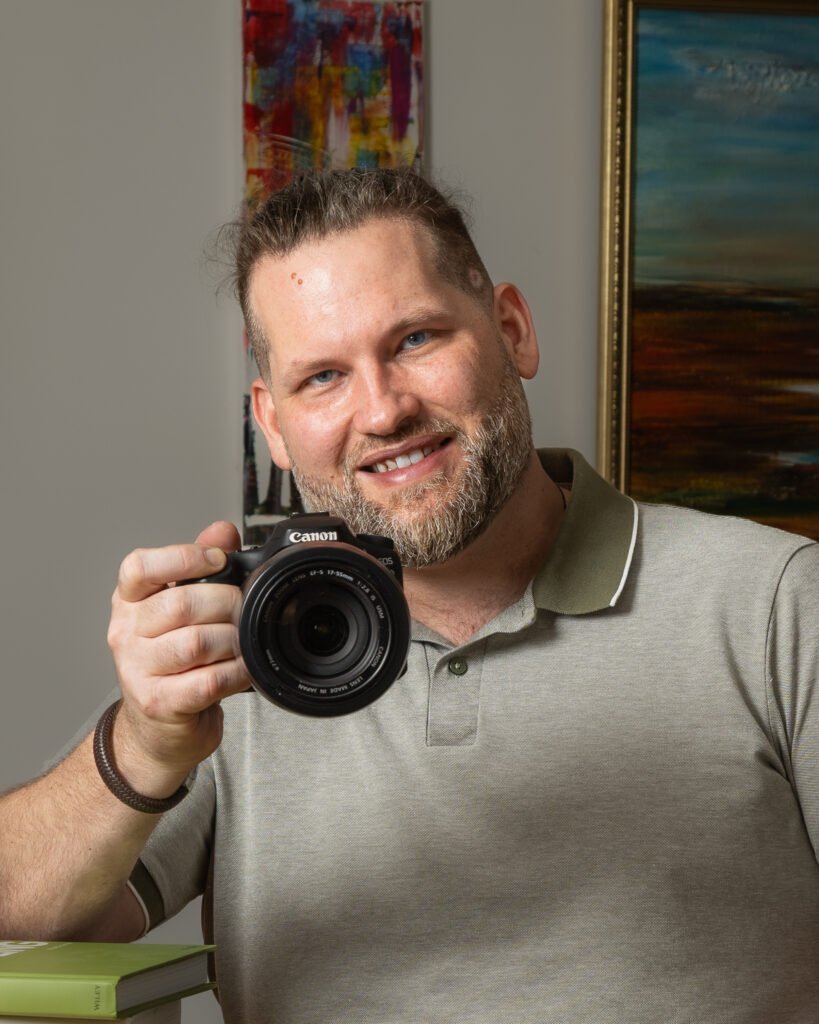 Andras Dietrich, London food photographer and development chef, holding a camera
