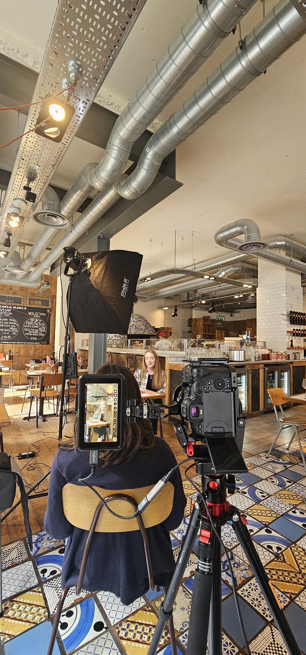 Lighting and camera being set up for an interview at Franco Manca on Baker Street, behind the scenes of a London restaurant video production.